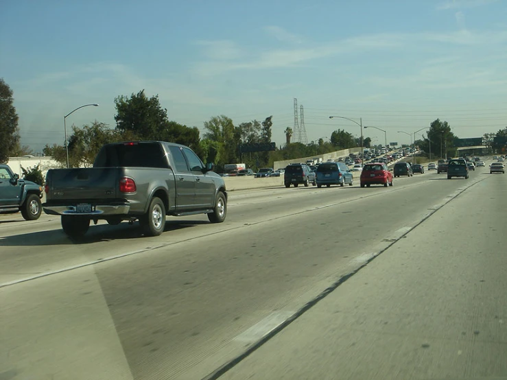 a line of cars driving down the highway