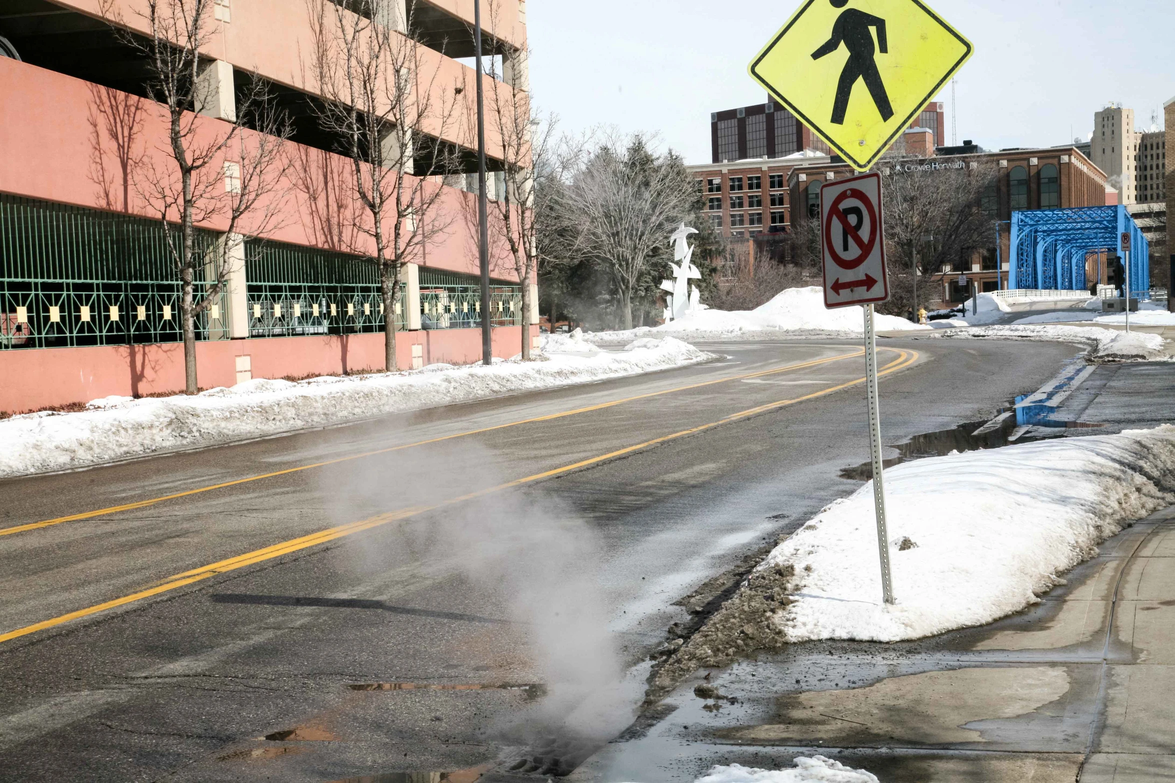 the smoke has reached from a pothole at the intersection