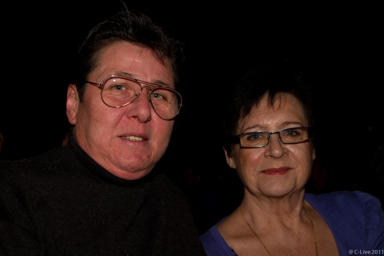 a man and woman at an event posing for a picture