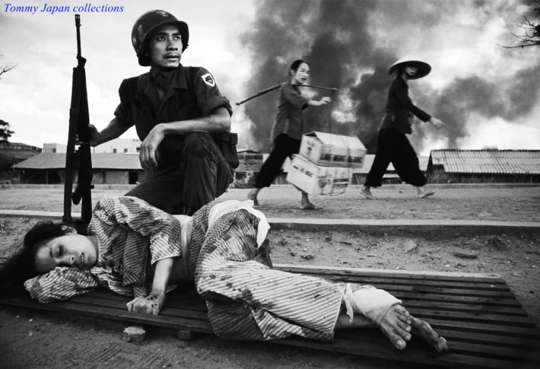 two soldiers and a girl lying down on a crate