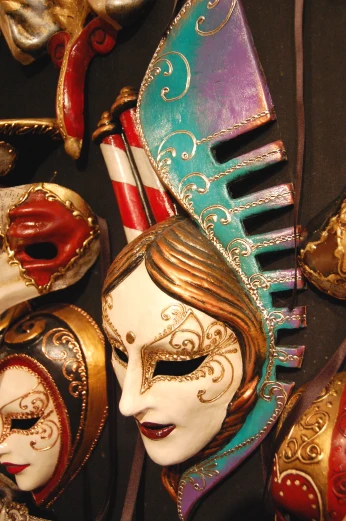 various masks laying on a table with different colors and designs