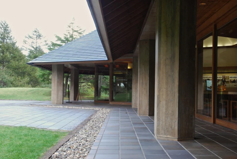 a walkway leads into a covered in room