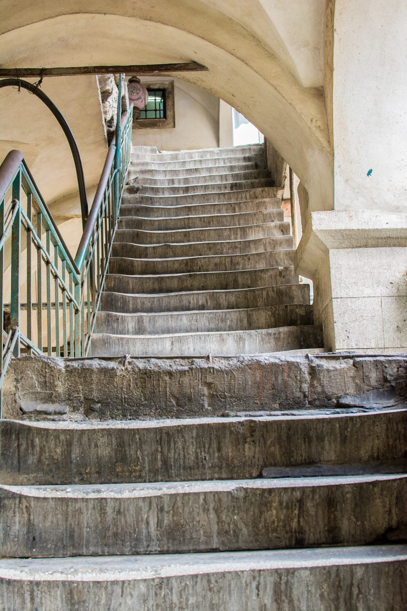 a bunch of steps leading to a building with a clock