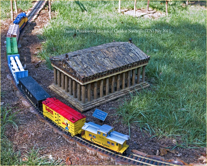 a toy model train with various colors on it