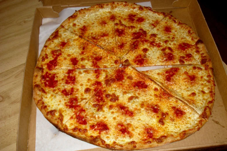 a pizza in a box with slices missing