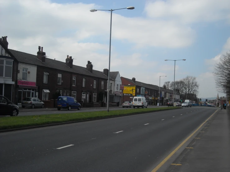 a street with a bus and buildings along the street