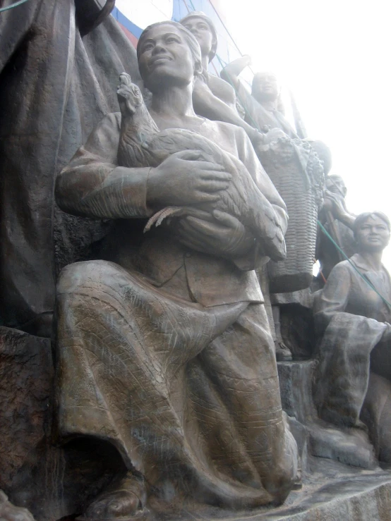 a statue depicting the life and times of men and women