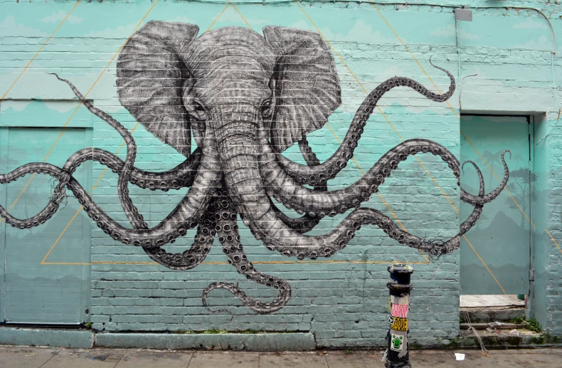 a large squid painting on the side of a building