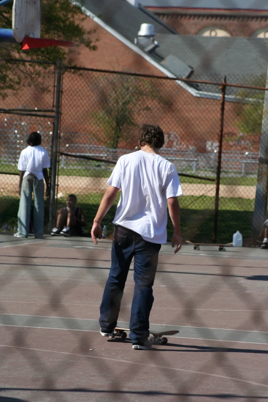 a boy riding a skateboard at a park