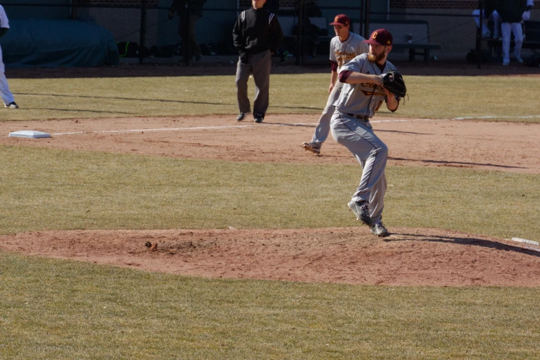 the pitcher is preparing for the next pitch to come