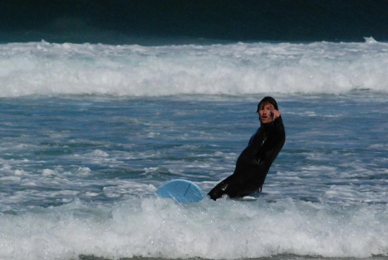 a surfer about to fall in the ocean