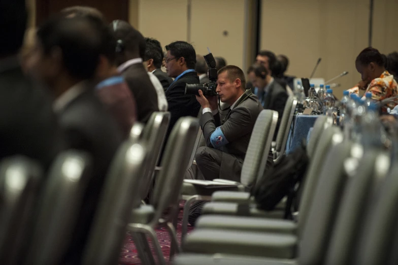 people sitting in chairs during a business meeting