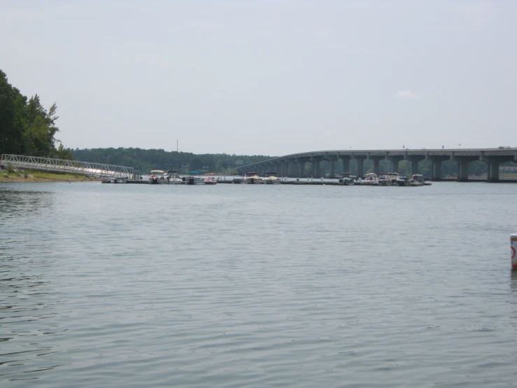 boats sitting in a harbor on top of a body of water