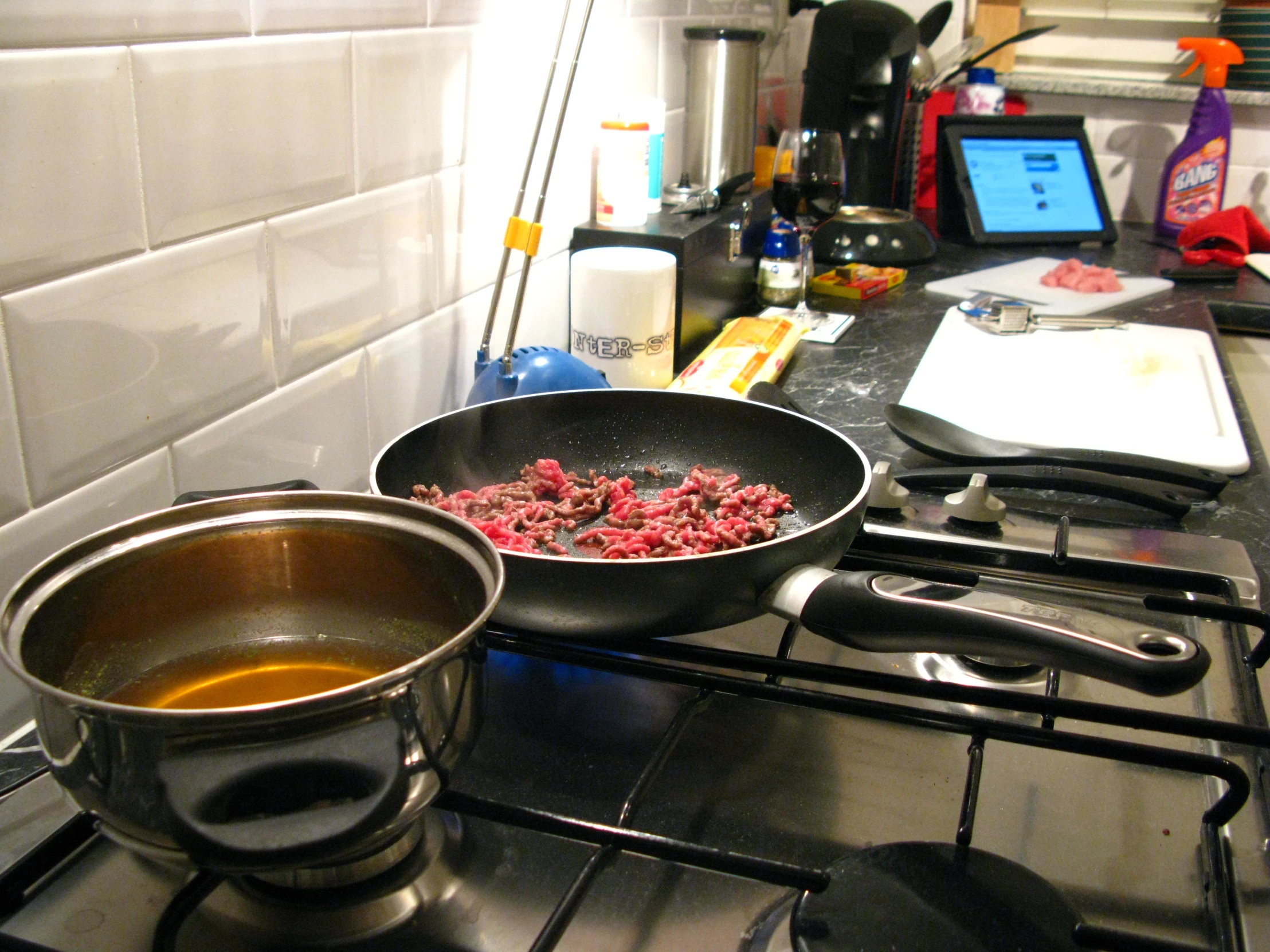 cooking in pots and cooking utensils on the stove