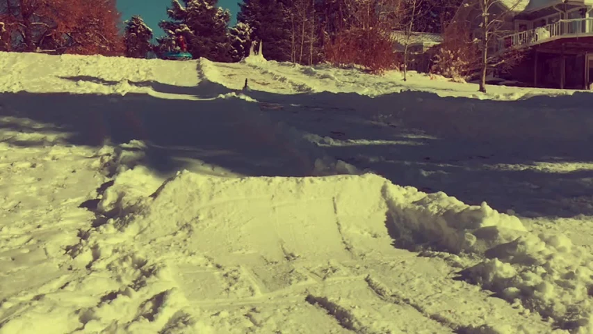 a man on a snow board is in the snow