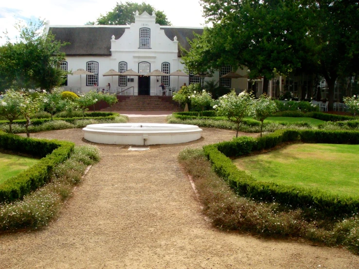 a building with many different shrubs around the top of it