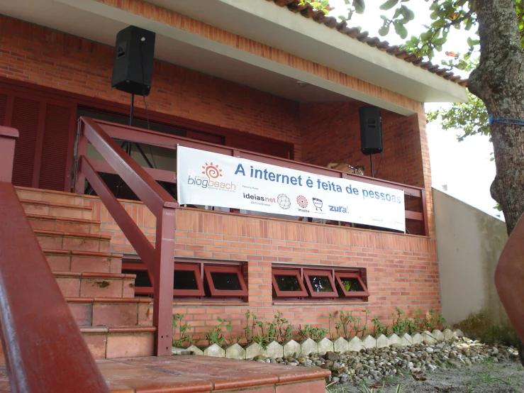 a sign in front of a brick building