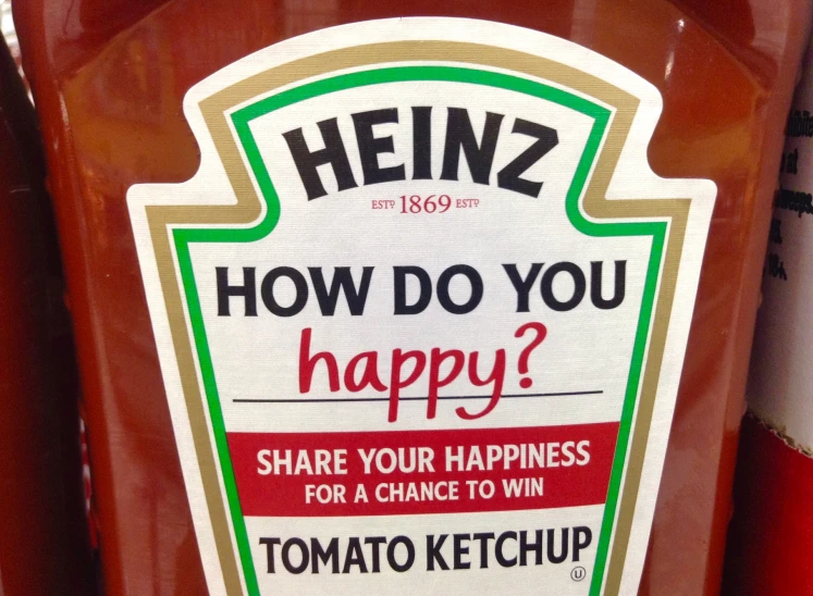 a sign advertising heinzz ketchup on a bottle