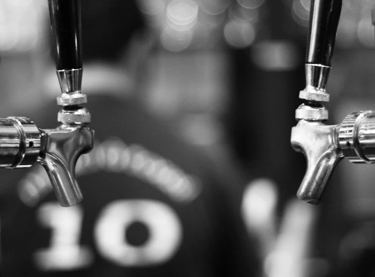 the bottom of a beer tap with three taps