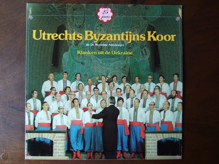 a large choir pograph on a wall with the cover of an album