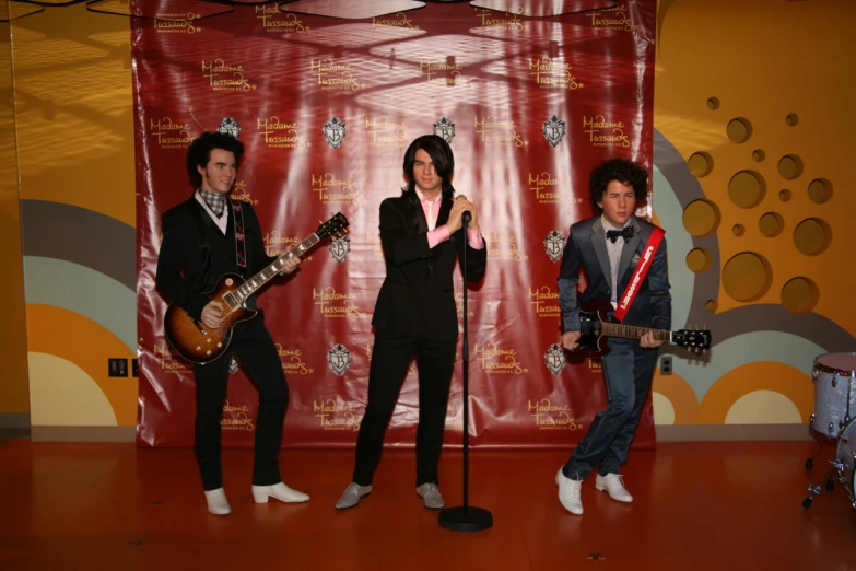 a group of people in costumes posing with guitars