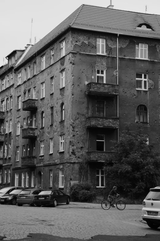 a dark gray building has a bunch of windows