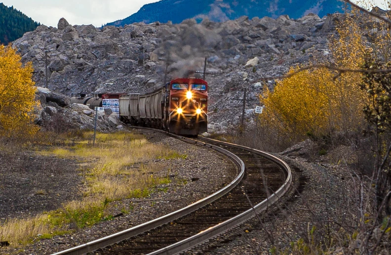 a train is riding along the railroad tracks