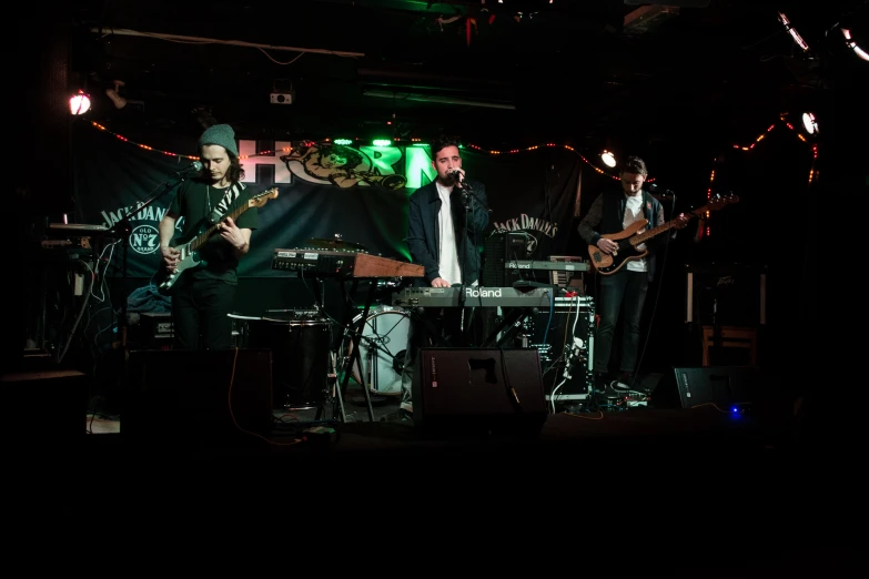 a band performing at a party with lights on