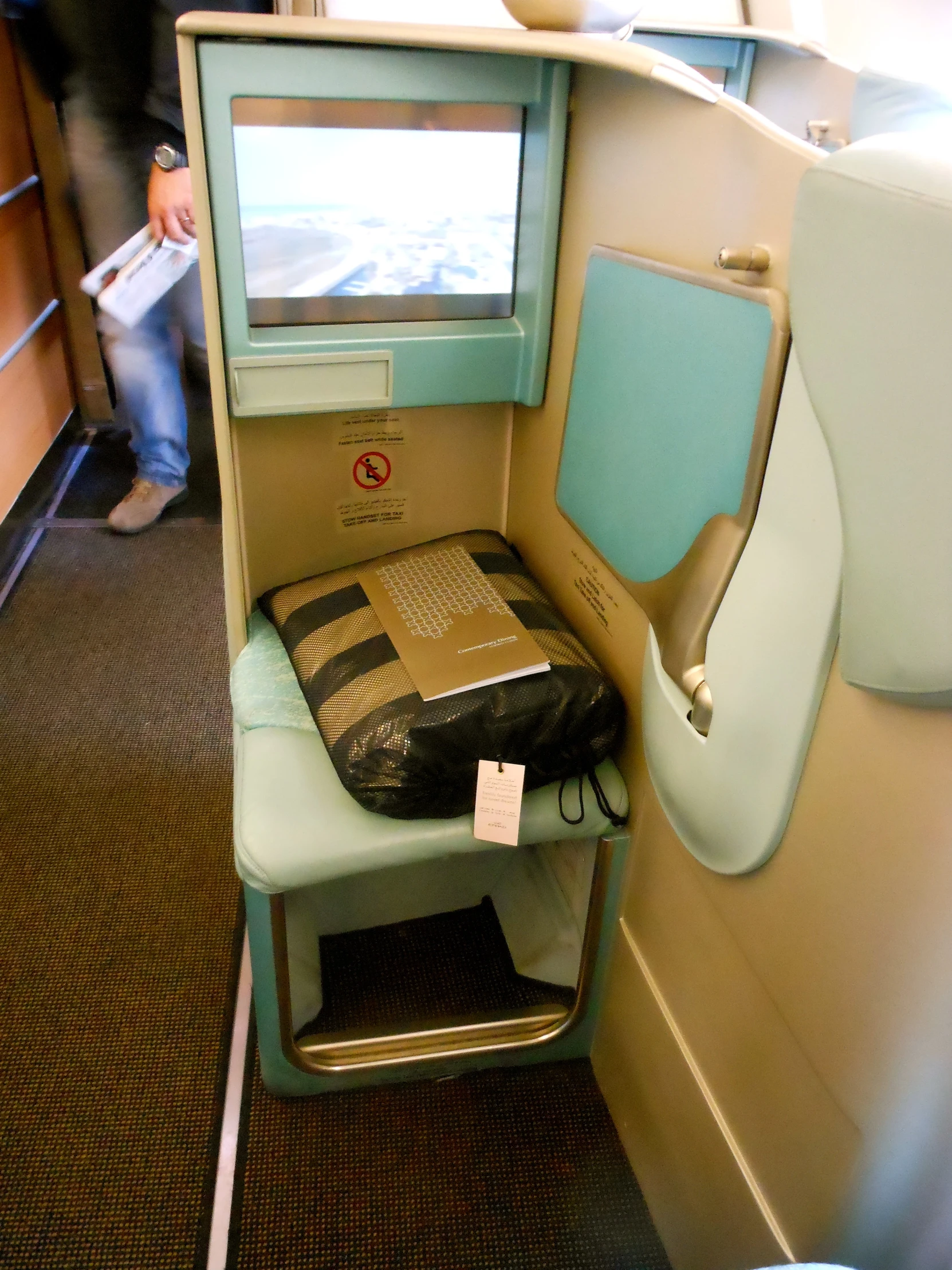 a seat for the airliner has a laptop on it