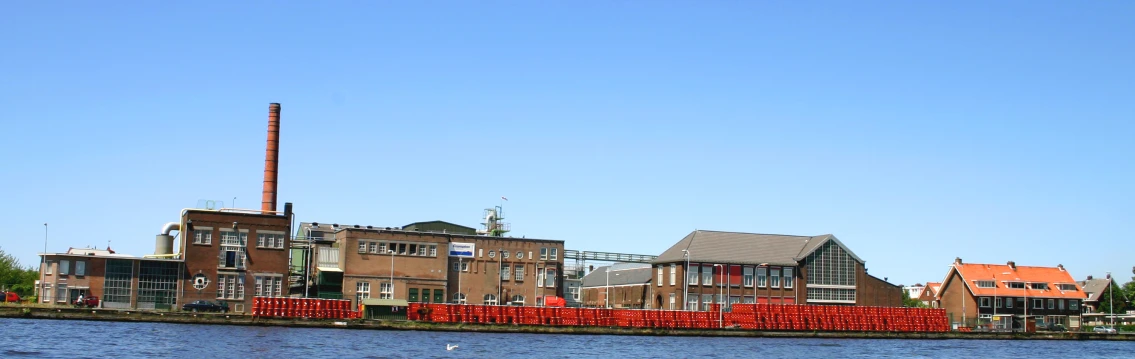 a row of buildings sitting next to a river