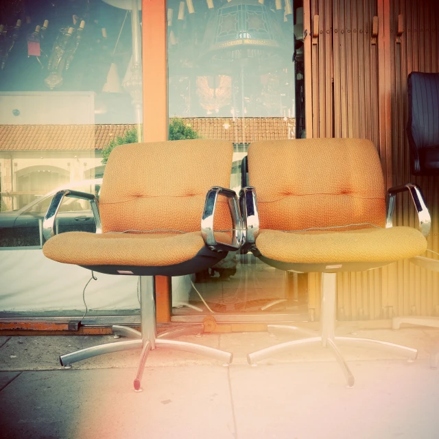 an outdoor area with a bench, and some chairs