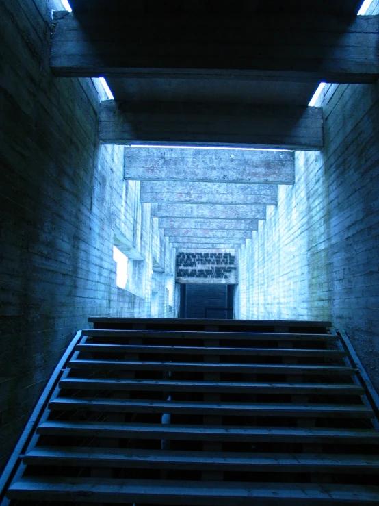 an image of stairs going down a hallway