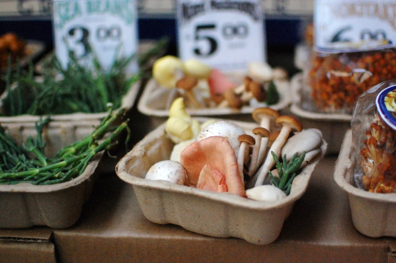 a table with some trays of different types of foods on it