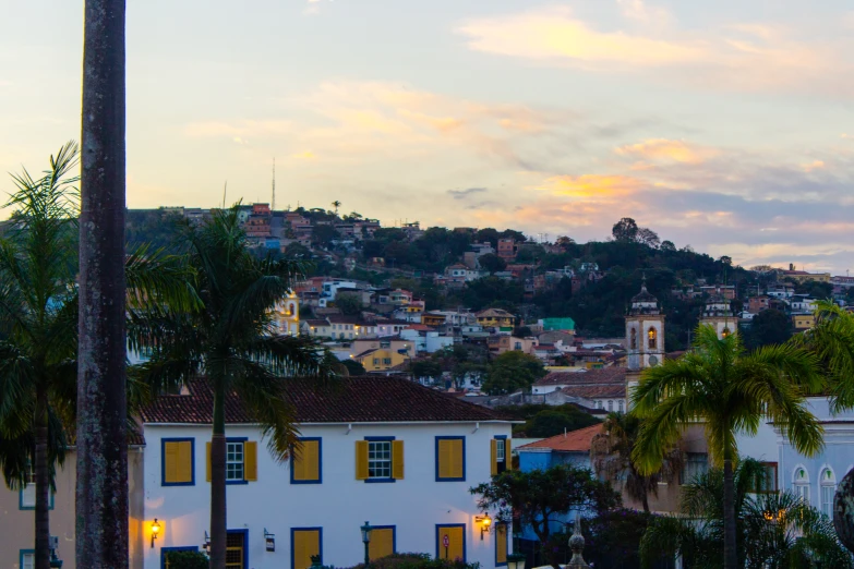 houses on the hills are lit up by street lights