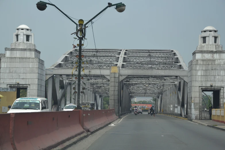 a bridge that goes over some cars going across