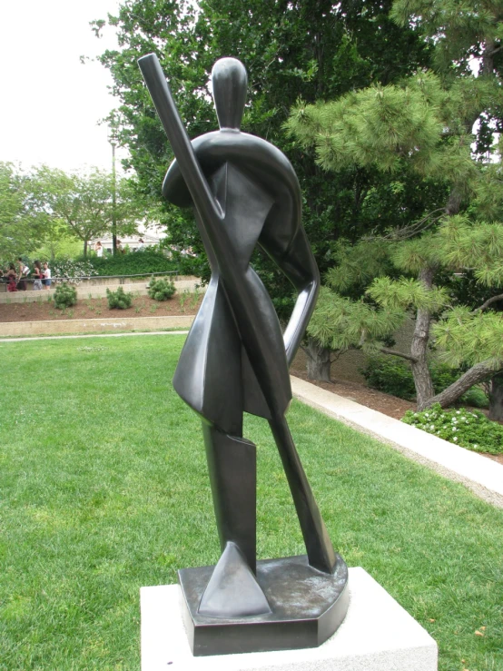 a statue of a man holding a baseball bat