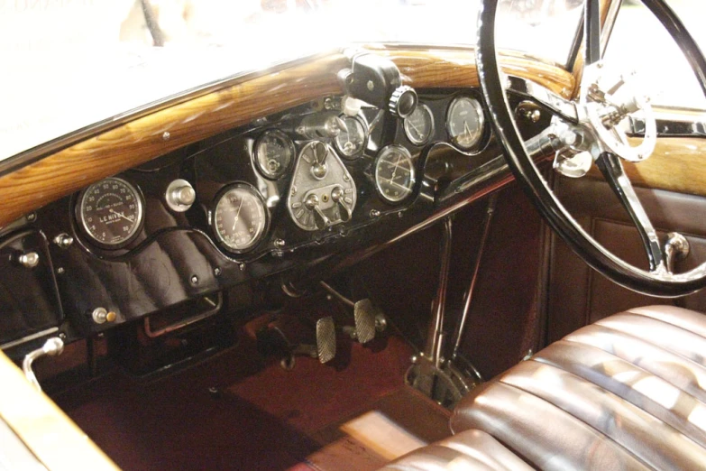 dashboard of old car with instrument controls in view