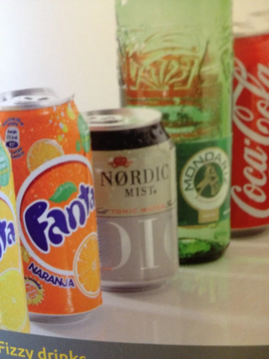 a close up of cans of soda on a table