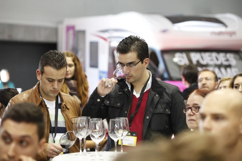 a group of people looking down at glasses