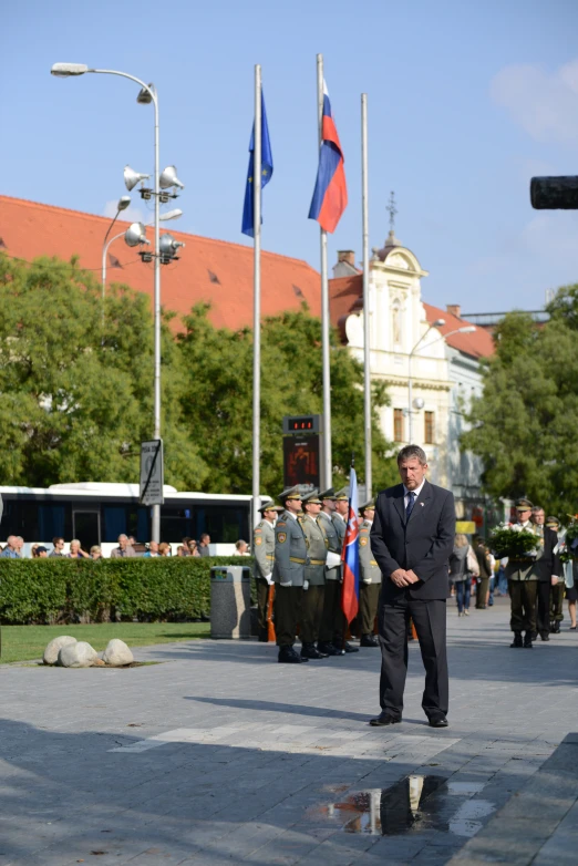 a group of people in military uniforms stand outside