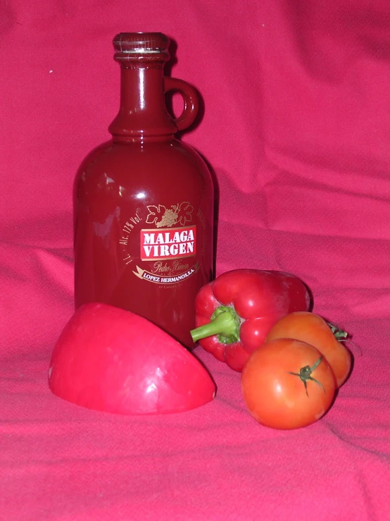 a bottle of ketchup and some sliced tomatoes