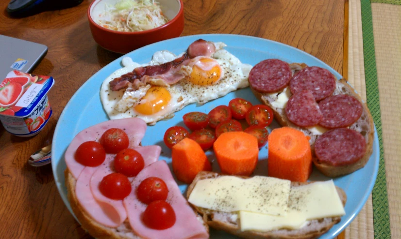 this plate has various meats and vegetables on it