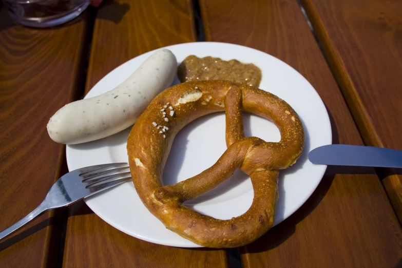 some pretzels are on a plate with a fork