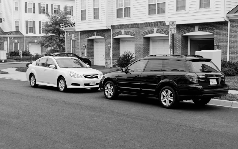 two vehicles parked on the side of the road