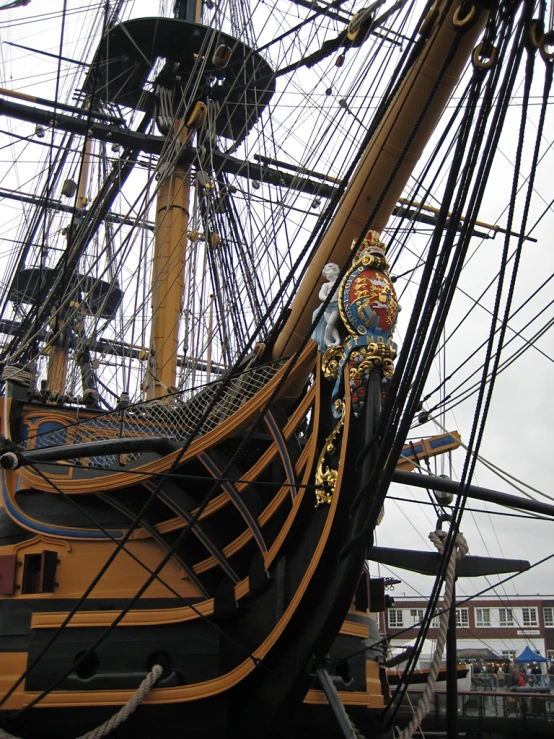 an old pirate ship docked in a dock