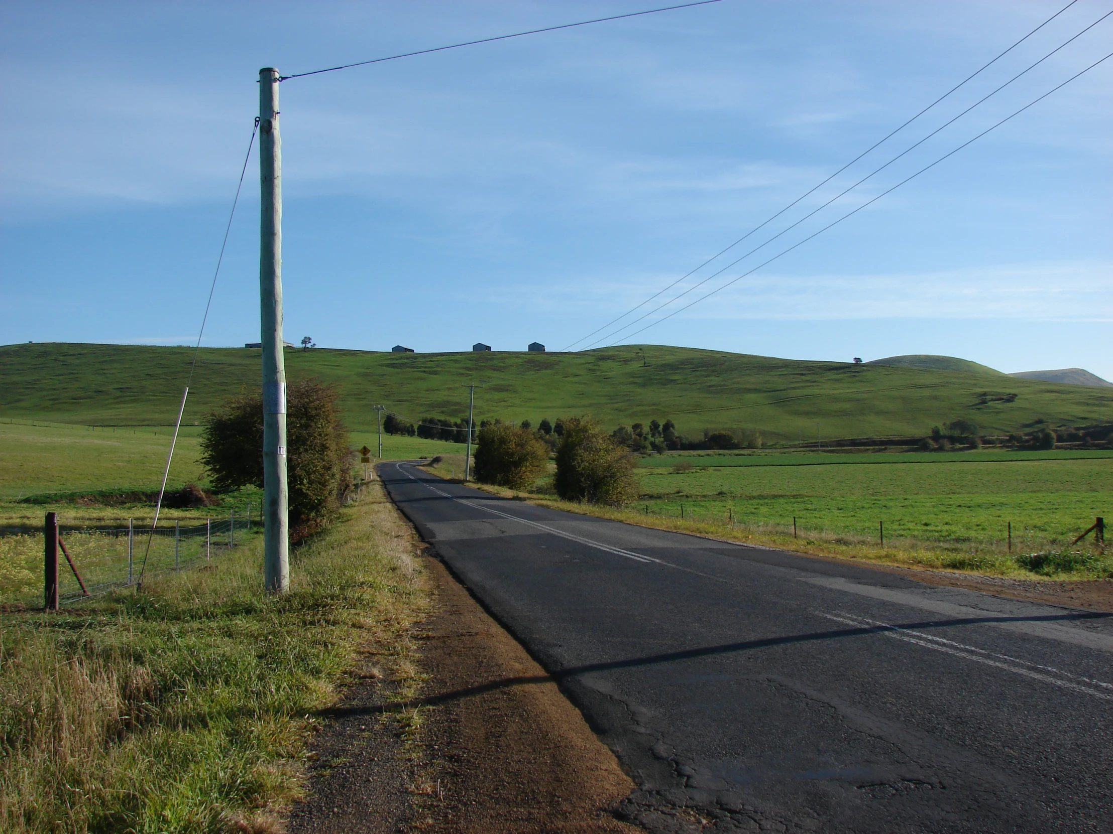 the long country road is empty of cars