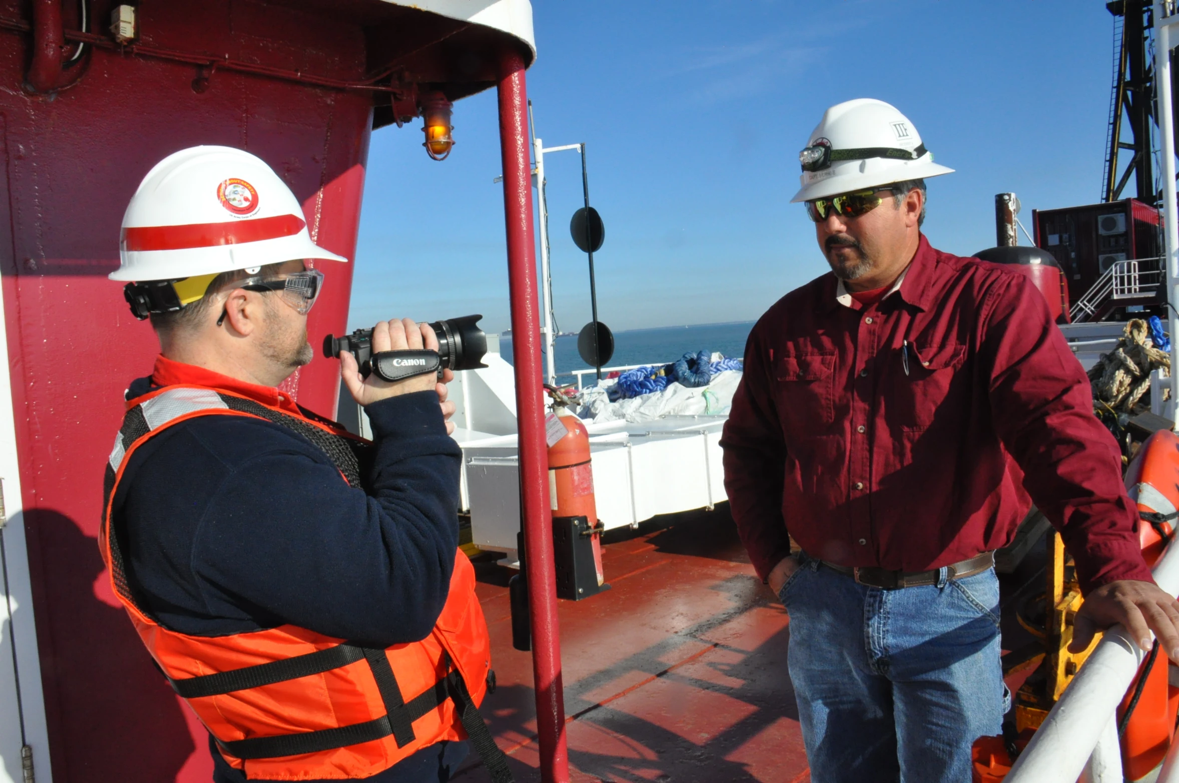 a man in safety gear on the front of a boat