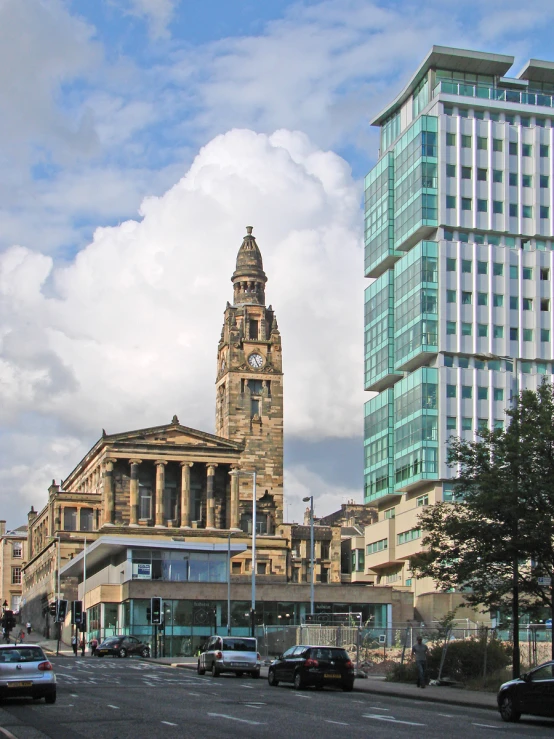 a big building sitting next to a tall tower