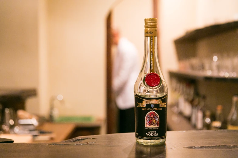 a bottle of liquor sits on top of the bar