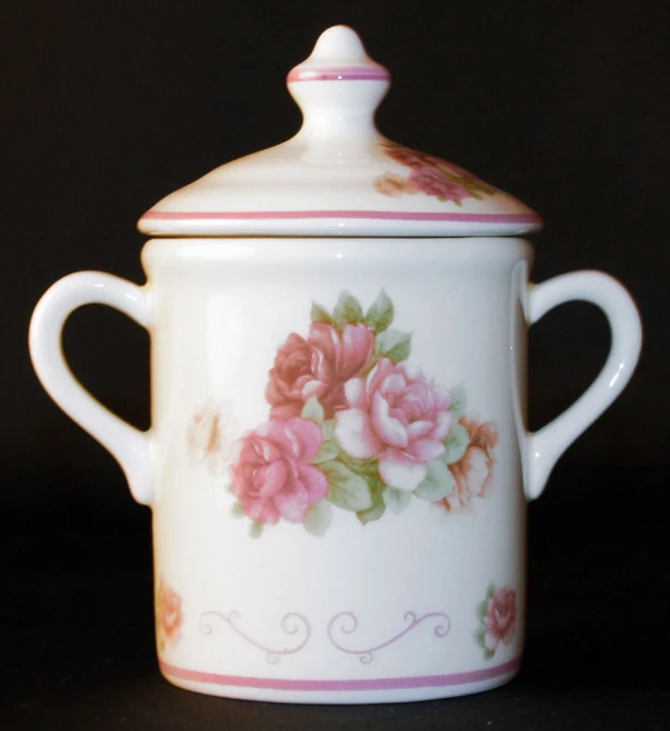 a flower - painted porcelain covered sugar jar